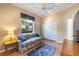 Functional bedroom with a sofa bed, closet, and a window overlooking the outdoors at 1307 Highland Greens Dr, Venice, FL 34285