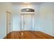 Welcoming foyer with wood flooring and a bright white front door at 1307 Highland Greens Dr, Venice, FL 34285