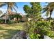 Charming single-story home with lush landscaping and palm trees at 1307 Highland Greens Dr, Venice, FL 34285