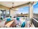 Comfortable screened-in lanai with ceiling fan, outdoor furniture, and a view of the beautiful backyard at 1307 Highland Greens Dr, Venice, FL 34285