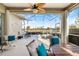 Screened-in lanai featuring a hot tub, ceiling fan, and an outdoor seating area with a view at 1307 Highland Greens Dr, Venice, FL 34285