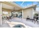 Inviting screened-in patio with outdoor dining and seating near a relaxing spa at 1307 Highland Greens Dr, Venice, FL 34285
