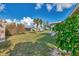Spacious backyard with lush grass and mature trees at 13540 Dibella Ave, Port Charlotte, FL 33981