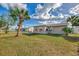 Large backyard with shed and tropical landscaping at 13540 Dibella Ave, Port Charlotte, FL 33981