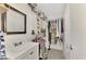 Clean bathroom with a vanity and walk-in closet at 13540 Dibella Ave, Port Charlotte, FL 33981