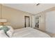 Cozy bedroom with white bedding and built-in dresser at 13540 Dibella Ave, Port Charlotte, FL 33981