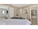 Spacious bedroom with white bedding and a dresser at 13540 Dibella Ave, Port Charlotte, FL 33981