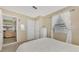 Bright bedroom with white bedding and a dresser at 13540 Dibella Ave, Port Charlotte, FL 33981