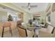 Dining room with glass-top table and view of kitchen at 13540 Dibella Ave, Port Charlotte, FL 33981