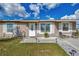 House exterior featuring a white door and landscaping at 13540 Dibella Ave, Port Charlotte, FL 33981