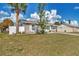 Single-story home with well-maintained lawn at 13540 Dibella Ave, Port Charlotte, FL 33981
