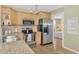 Updated kitchen with stainless steel appliances and granite countertops at 13540 Dibella Ave, Port Charlotte, FL 33981