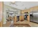 Open concept kitchen with island, stainless steel appliances, and granite countertops at 13540 Dibella Ave, Port Charlotte, FL 33981