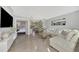 Open living area showcasing a sectional sofa and Christmas tree at 13540 Dibella Ave, Port Charlotte, FL 33981