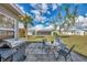 Relaxing patio with seating area and grill, perfect for outdoor entertaining at 13540 Dibella Ave, Port Charlotte, FL 33981