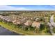 Aerial view of a luxury community with lakefront homes at 13807 Karina St, Venice, FL 34293