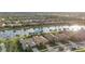 Aerial view of community with lake and various houses at 13807 Karina St, Venice, FL 34293