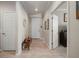 Bright and airy entryway with tile flooring and a wooden bench at 13807 Karina St, Venice, FL 34293