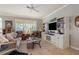 Spacious living room with comfortable seating and built-in shelving at 13807 Karina St, Venice, FL 34293