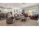 Open-concept living room with kitchen views and comfortable seating at 13807 Karina St, Venice, FL 34293