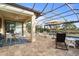 Spacious screened pool area with patio furniture, offering a relaxing outdoor space at 13807 Karina St, Venice, FL 34293