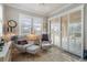Sunroom with two armchairs and view of the pool and patio at 13807 Karina St, Venice, FL 34293
