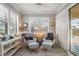 Sunroom with two armchairs and access to patio at 13807 Karina St, Venice, FL 34293
