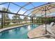 Relaxing pool with screened enclosure and serene water views at 13807 Karina St, Venice, FL 34293