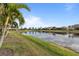 Tranquil waterfront view with lush greenery and homes at 13807 Karina St, Venice, FL 34293