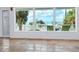 Bright living room with large windows and ocean views at 1608 Casey Key Rd, Nokomis, FL 34275