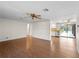 Open living room with hardwood floors and access to kitchen and patio at 1771 Gale St, Englewood, FL 34223