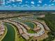 Aerial view of the property, highlighting its position within the community and near waterways at 20303 Lagente Cir, Venice, FL 34293