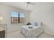 Bedroom with full-size bed and large window with blinds at 20303 Lagente Cir, Venice, FL 34293