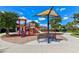 playground with playset, slide, and shaded seating area at 20303 Lagente Cir, Venice, FL 34293