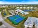 Community pool and tennis courts aerial view at 2081 Willow Hammock Cir # F204, Punta Gorda, FL 33983