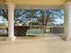Relaxing covered patio with a bench and lake view at 2081 Willow Hammock Cir # F204, Punta Gorda, FL 33983