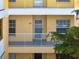 Condo building exterior, showcasing the building's facade and balcony at 2081 Willow Hammock Cir # F204, Punta Gorda, FL 33983