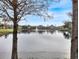 Tranquil lake view with community buildings at 2081 Willow Hammock Cir # F204, Punta Gorda, FL 33983