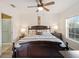 Large main bedroom with king-size bed and en-suite bathroom at 2081 Willow Hammock Cir # F204, Punta Gorda, FL 33983