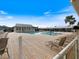 Community pool with lounge chairs and a pool house at 2081 Willow Hammock Cir # F204, Punta Gorda, FL 33983