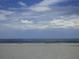 Expansive beach with blue sky and clouds at 2090 Piave Ln, Venice, FL 34292