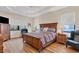 Spacious bedroom with wood flooring and a large bed at 2090 Piave Ln, Venice, FL 34292