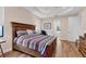 Bedroom with wood flooring and en-suite bathroom access at 2090 Piave Ln, Venice, FL 34292
