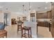 Updated kitchen featuring stainless steel appliances and a breakfast bar at 2090 Piave Ln, Venice, FL 34292