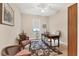 Home office with wood desk and comfortable seating at 2090 Piave Ln, Venice, FL 34292