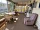 Relaxing screened porch with seating and a table at 230 Outer Dr, Venice, FL 34285