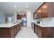 Modern kitchen with stainless steel appliances and granite countertops at 24076 Spartina Dr, Venice, FL 34293