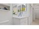Bright bathroom with vanity and toilet; beachy decor at 287 Cassano Dr, Nokomis, FL 34275