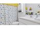 Clean bathroom with shower/tub combo and nautical theme at 287 Cassano Dr, Nokomis, FL 34275