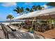 Outdoor seating area of beachfront restaurant under a tent at 287 Cassano Dr, Nokomis, FL 34275